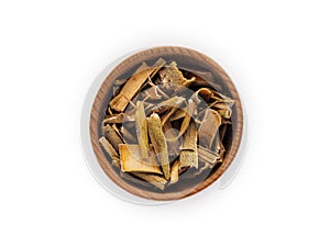 Willow bark in wooden Cup on white background