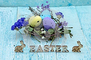 Willow twigs. Easter eggs. The word Easter. Easter bunny and chicken