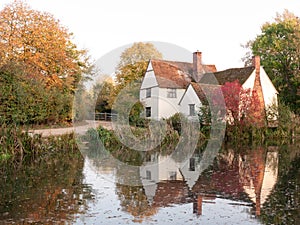 willy lotts cottage at flatford mill in suffolk in autumn reflections in lake