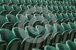 Rows of empty green spectators` chairs at Wimbledon All England Lawn Tennis Club.