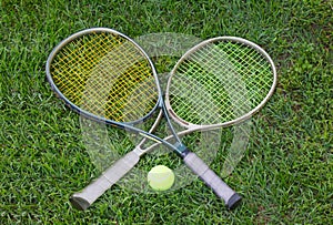 Wimbledon sign, two tennis rackets with a ball photo