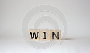 Win symbol. Wooden blocks with words Win. Beautiful white background. Business and Win concept. Copy space