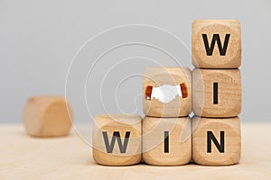 Win win situation printed on wooden cubes