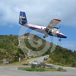 Winair plane landing at St Barts airport.