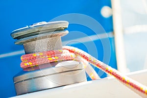 Winch capstan with rope on sailing boat.