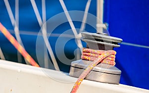Winch capstan with rope on sailing boat.