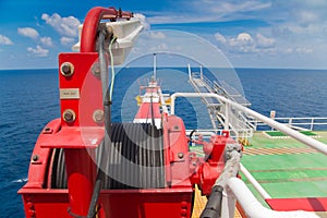 Winch of crane boom at oil and gas wellhead remote platform.