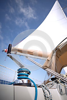 Winch with rope on a sail boat in the sea