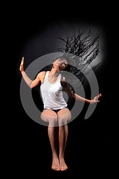 Wind -afro american woman with long flapping hairs photo