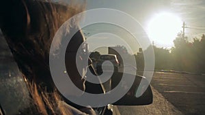 Wind Blowing Through Girl's Hair In a car with family. Sunset