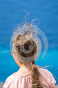 Wind blowing into girls hair