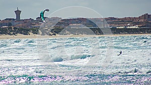 Training kitesurfing in the bustling waters of Baleal beach, Portugal