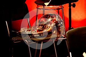 wind brass musical instrument horn lies on a chair in the theater