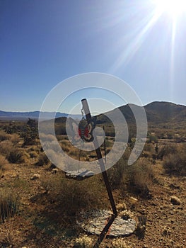 Wind chimes with figures of buterfly hanging outdoor in desert Arizona