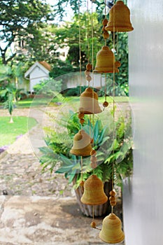 Wind chimes outside a cottage hanging on the porch