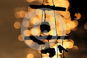 Wind chiming with shells by the sea at dusk on a blurred background