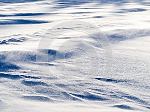 Wind drift snow flying over snow surface refief