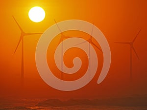 Wind-driven generator and golden sunset
