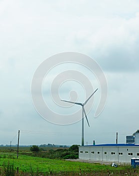 Wind-driven generator in the middle of a field