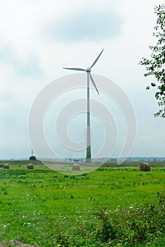Wind-driven generator in the middle of a field