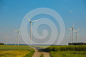 Wind energy.Wind generators in a wheat field.Green energy.Ripe wheat and windmills.Electricity and green energy.Natural