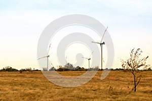 Wind energy. Wind power. Sustainable, renewable energy. Wind turbines generate electricity. Windmill farm on mountain