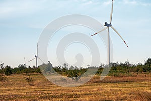 Wind energy. Wind power. Sustainable, renewable energy. Wind turbines generate electricity. Windmill farm on mountain