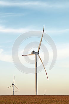 Wind energy. Wind power. Sustainable, renewable energy. Wind turbines generate electricity. Windmill farm on mountain