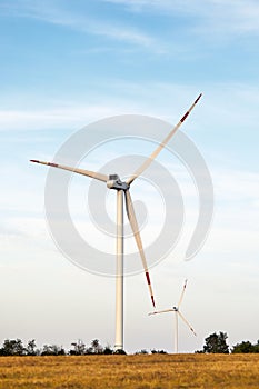 Wind energy. Wind power. Sustainable, renewable energy. Wind turbines generate electricity. Windmill farm on mountain
