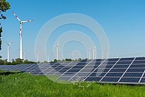 Wind engines and solar panels on a sunny day