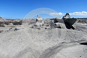 Wind-eroded rock formations of gray sand stone photo