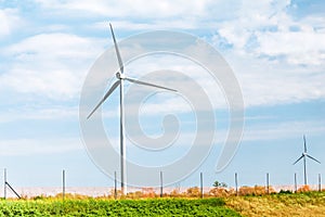 wind farm against blue sky background, green and renewable energy sources concept