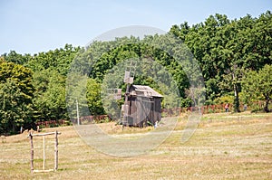 Wind Farm. Dutch windmill. Landscape with traditional Ukrainian windmills houses in countryside village. Windmill mill at rural