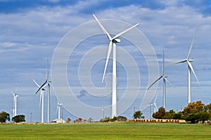 Wind farm and hay bales