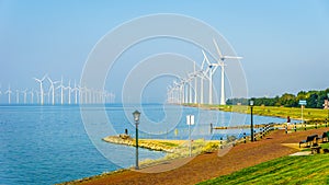 Wind Farm in the inland sea named IJselmeer seen from the historic fishing village of Urk