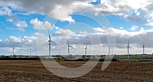 Wind farm park near Yelvertoft on bright cloudy day