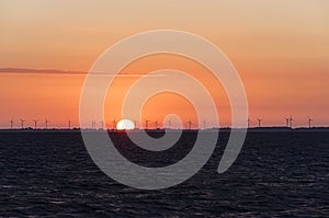 Wind farm in sunrise at Szczecin lagoon Poland