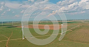 On a wind farm in Texas, U.S., one can see a row of windmill turbines which produce renewable energy.