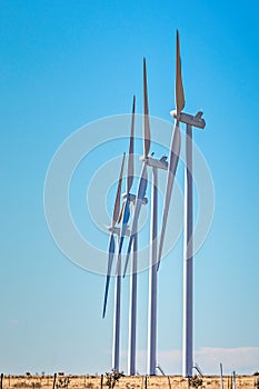 Wind farm in Texas, windmills in a row, copy space