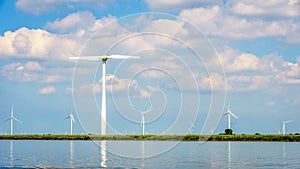Wind Farm with Two and Three bladed Wind Turbines along the Shore of Veluwemeer