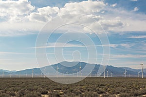 Wind Farm in Western Desert with Blue Skies and Clouds Overhead