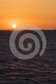 Wind farm ZagÃ³rze in sunrise at Szczecin lagoon Poland
