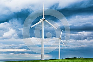 Wind farms in Scotland - wind turbines provide electricity green energy for households in UK