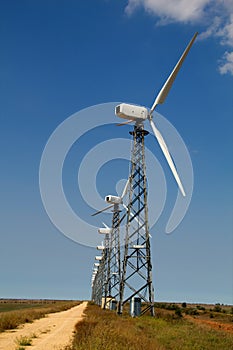 The wind generator against the blue sky photo