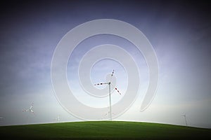 Wind generator on green hill