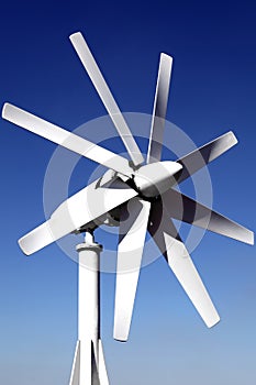 Wind generator on the roof of the office. against the blue sky. Energy savings. Saving features electricity.