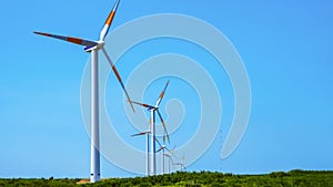 Wind generators on the highlands of Madeira island against the blue sky. Copy space.