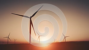 Wind generators on land. Red Sky. Sunset soft light. Green energy. Modern eco windmill. Timelapse