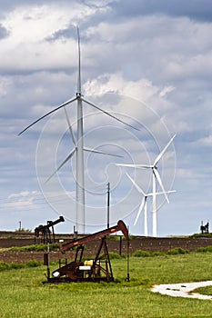 Wind generators and oil wells photo