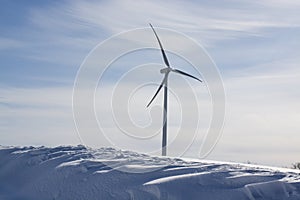 wind generators under blue sky, snow landscape .Powerplant electric turbine. clean energy and eco energy concept